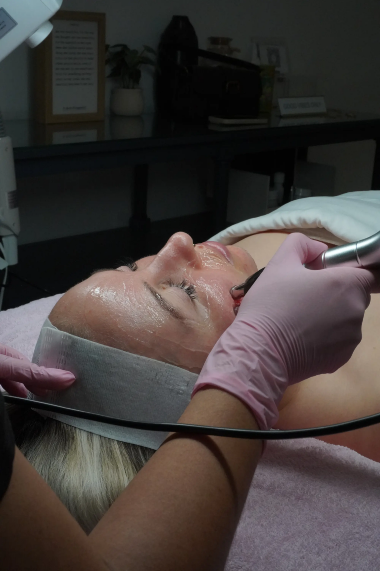 Professional facial rejuvenation treatment with handheld device